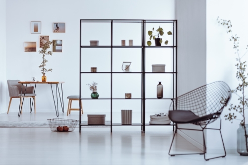Metal,Chair,In,Bright,Living,Room,With,Shelves,And,Table